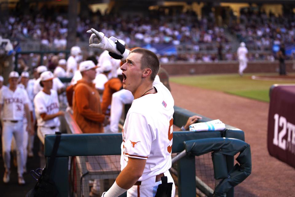 Texas Longhorns infielder Jared Thomas (9) celebrates a homer against the Texas A&M Aggies during the second round in the NCAA baseball College Station Regional at Olsen Field College Station.