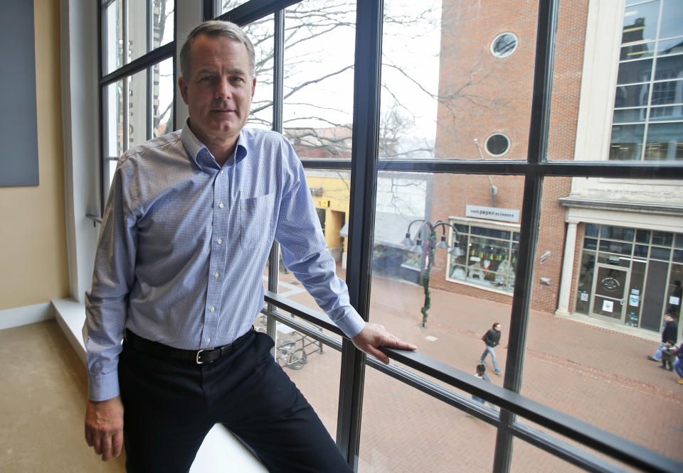 In this Thursday Jan. 3, 2019, photo investor and Democratic donor Michael Bills poses for a photo in Charlottesville, Va. Bills is spending millions of dollars to try to weaken the political influence of Dominion Energy. (AP Photo/Steve Helber)