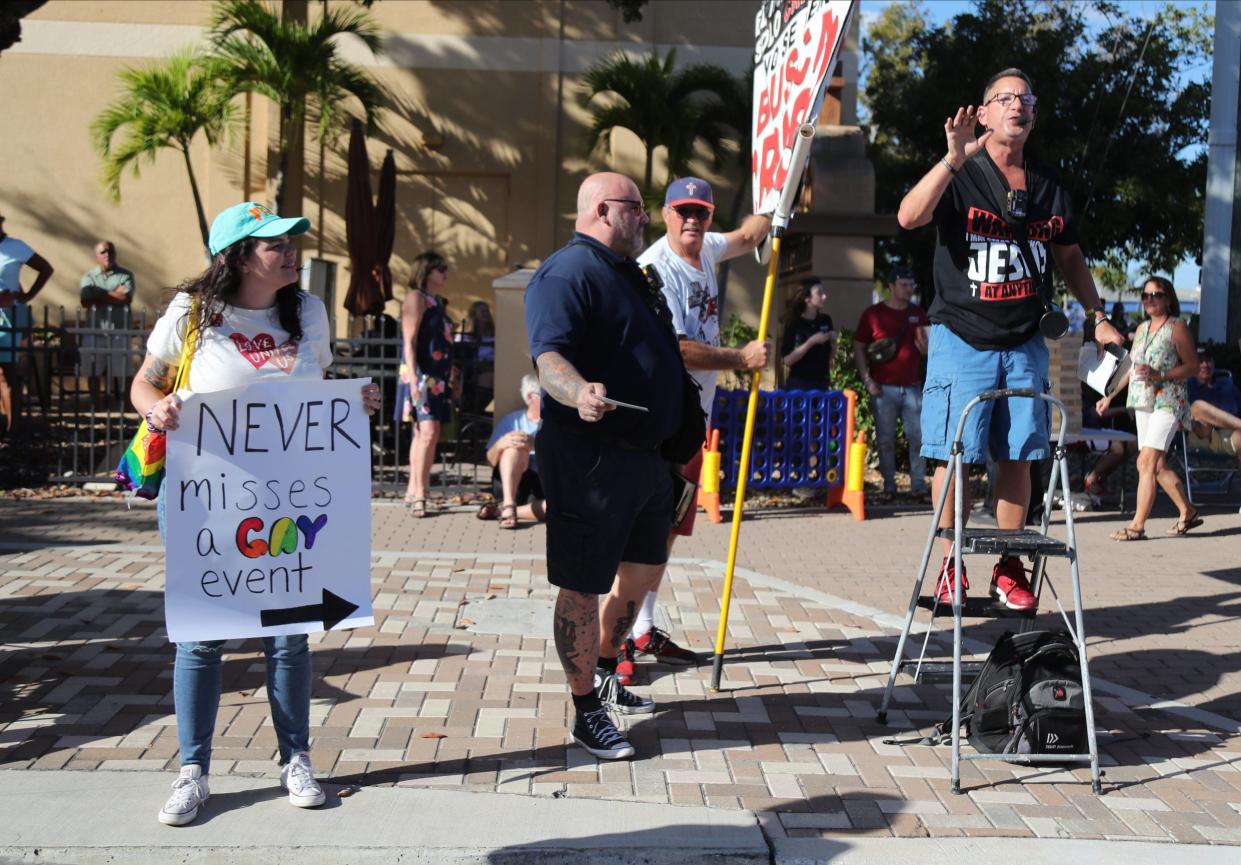 A street preacher addresses passers-by during a Cape Coral Pride parade in this March 5 file photo. A federal appeals court on Tuesday sided with a man who challenged a Fort Myers Beach ordinance that prevented him from carrying a sign with a Christian message on the town’s streets.