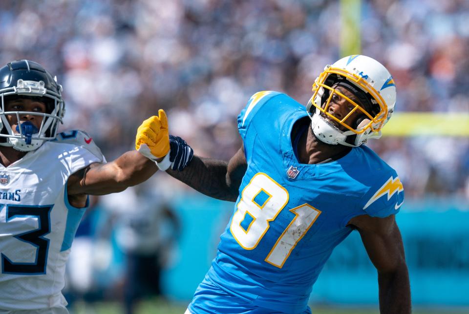 Los Angeles Chargers wide receiver Mike Williams can't catch up to an overthrown pass while defended by Tennessee Titans cornerback Tre Avery at Nissan Stadium, Sunday, Sept. 17, 2023.