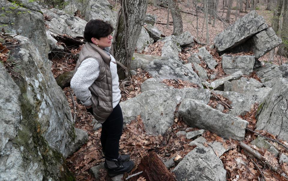 Tracey Bilski walks among the ceremonial stone landscapes on her Chappaqua property April 19, 2022. 