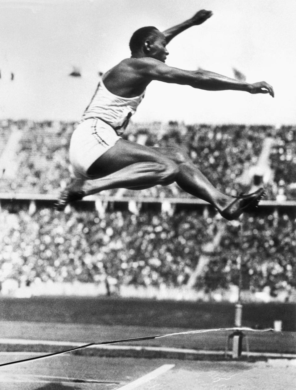 american track athlete jesse owens makes the long jump that set an olympic record in berlin at the 1936 olympic games his performance at the games in several events was one of the major upsets to german dictator adolf hitlers hopes that german athletes would prove their superiority in athletic endeavors