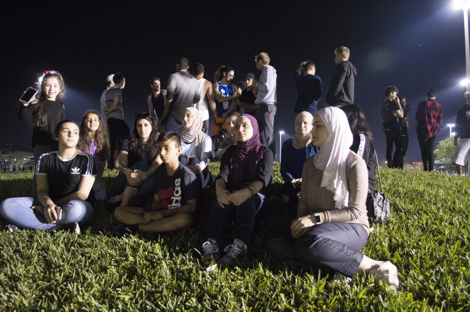 A group of Muslim students gather in remembrance of those who died in Wednesday's school shooting.