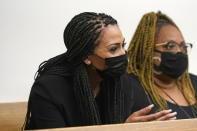 Ashley Sherman, left, wife of free agent NFL football player Richard Sherman, sits with another woman during a hearing about her husband at King County District Court, Thursday, July 15, 2021, in Seattle. Richard Sherman was arrested early Wednesday, police said, after he crashed his car in a construction zone and then tried to break into his in-laws' home in the Seattle suburb of Redmond, Wash. (AP Photo/Elaine Thompson)