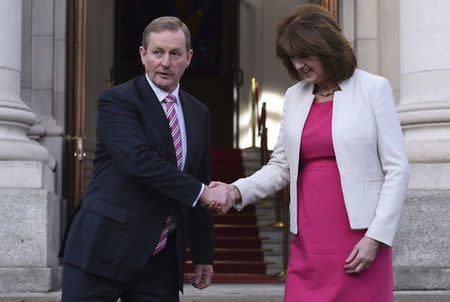 Ireland's Taoiseach Enda Kenny and Tanaiste Joan Burton depart Government Buildings after announcing the beginning of the General Election in Dublin, Ireland on February 03, 2016. EUTERS/Clodagh Kilcoyne