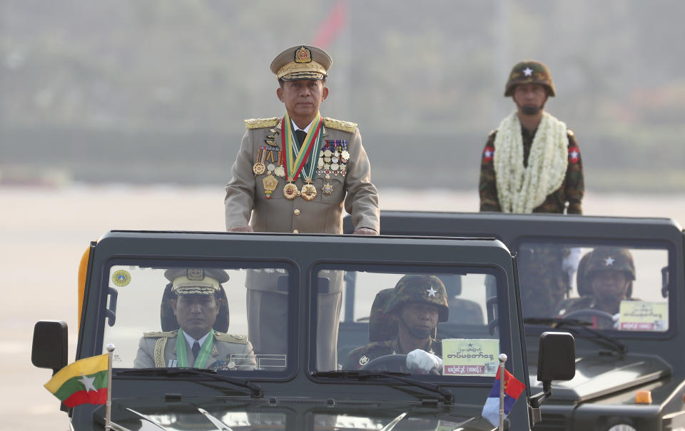 Senior Gen. Min Aung Hlaing, left, head of the military council, inspects officers during a parade to commemorate Myanmar's 78th Armed Forces Day in Naypyitaw, Myanmar, Monday, March 27, 2023. (AP Photo/Aung Shine Oo)