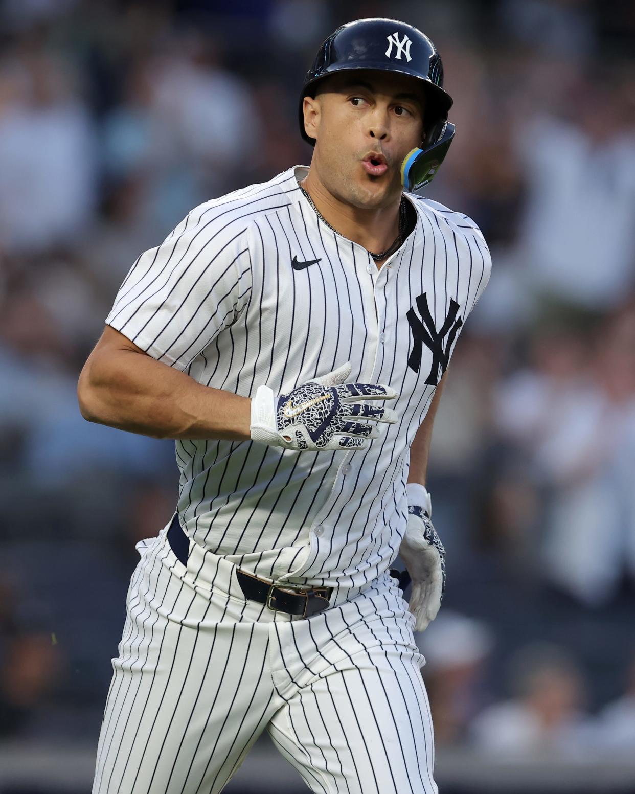 May 8, 2024; Bronx, New York, USA; New York Yankees designated hitter Giancarlo Stanton (27) reacts as he rounds the bases after hitting a solo home run against the Houston Astros during the third inning at Yankee Stadium. Mandatory Credit: Brad Penner-USA TODAY Sports