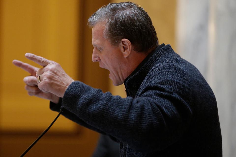 Pastor John Lowe prays during Indiana Pastors Alliance prayer rally at the Statehouse Tuesday, Nov. 17, 2015, in Indianapolis. Supporters and opponents of expanding LGBT rights in Indiana have descended on the Statehouse, with both sides citing Christian beliefs as justification for their positions.