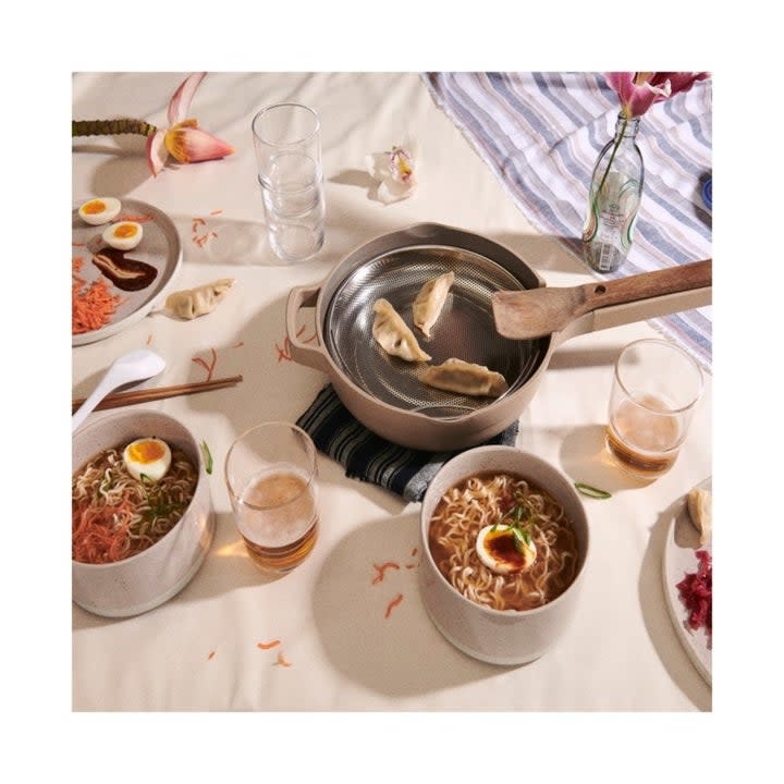 The pot being used to steam dumplings