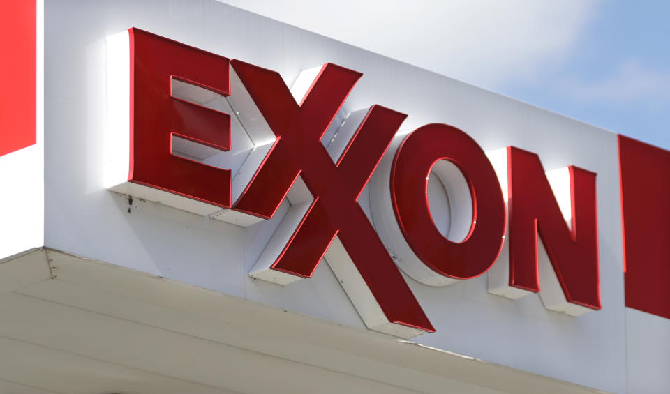 FILE- An Exxon service station sign is seen, April 25, 2017, in Nashville, Tenn. Exxon Mobil is buying pipeline operator Denbury, the beneficiary of changes in U.S. climate policy that intended to reduce the amount of emissions released into the atmosphere. Exxon Mobil Corp. said Thursday, July 13, 2023, that the acquisition gives it the largest owned and operated carbon dioxide pipeline network in the U.S. at 1,300 miles. (AP Photo/Mark Humphrey, File)