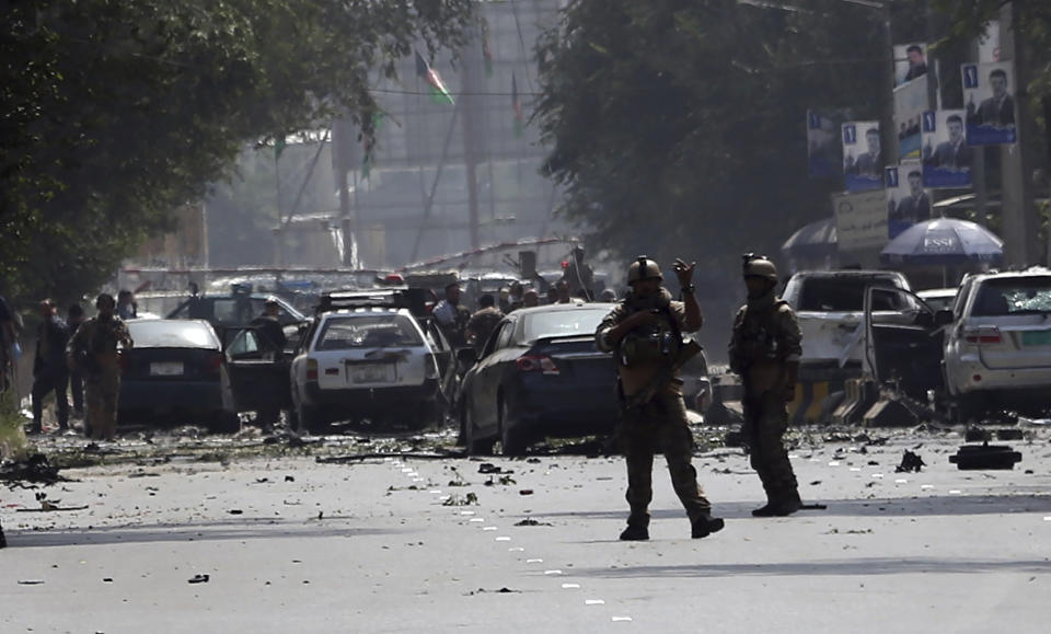 Afghan security personnel arrive at the site of car bomb explosion in Kabul, Afghanistan, Thursday, Sept. 5, 2019. A large car bomb rocked the Afghan capital on Thursday and smoke rose from a part of eastern Kabul near a neighborhood housing the U.S. Embassy, the NATO Resolute Support mission and other diplomatic missions. At least three people were killed and another 30 wounded, a hospital director said. (AP Photo/Rahmat Gul)