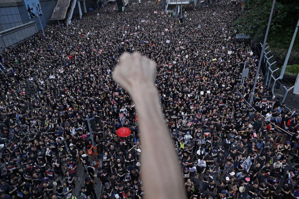 Unrest in Hong Kong is turning investors to safe haven investments like bitcoin at a premium: | Source: AP Photo/Vincent Yu, File)