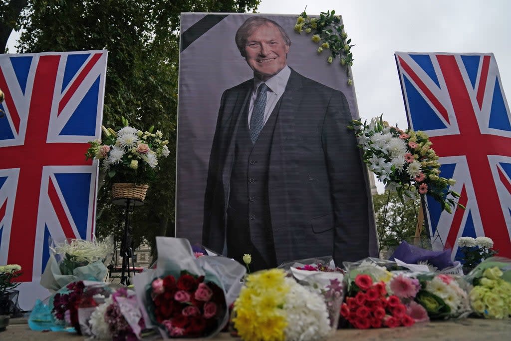 People from the UK Iranian community hold a vigil for Sir David Amess in Parliament Square (Victoria Jones/PA) (PA Wire)