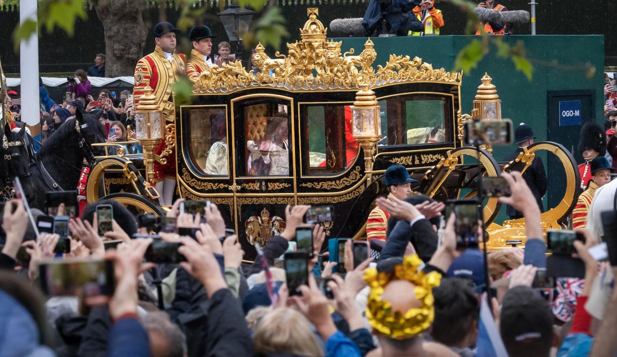 May 6, 2023; London, England; King Charles III and Queen Camilla process along The Mall in the Diamond Jubilee State Coach on the morning of their coronation in London. The May 6 event marks the first time in 70 years that Britain has crowned a new monarch.The last coronation took place for the late Queen Elizabeth II on June 2, 1953.