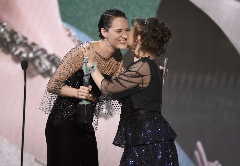 Phoebe Waller-Bridge, left, presents the award for outstanding performance by an ensemble in a drama series to Helena Bonham Carter at the 26th annual Screen Actors Guild Awards at the Shrine Auditorium & Expo Hall on Sunday, Jan. 19, 2020, in Los Angeles. (Photo/Chris Pizzello)