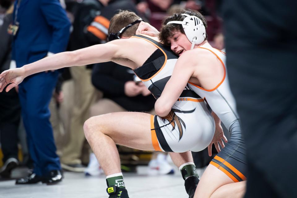 Central York's Eli Long (right) wrestles Greater Latrobe's Nate Roth in the 139-pound 7th-place bout at the PIAA Class 3A Wrestling Championships at the Giant Center on March 11, 2023, in Hershey. Roth won by decision, 10-7.