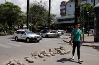 A pedestrian walks at the El Prado in Cochabamba