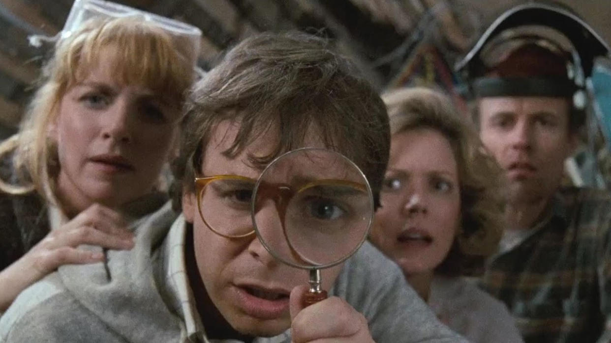  Rick Moranis with a magnifying glass. 