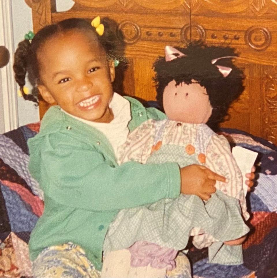 Shawn R. Jones' daughter with one of her Black dolls.