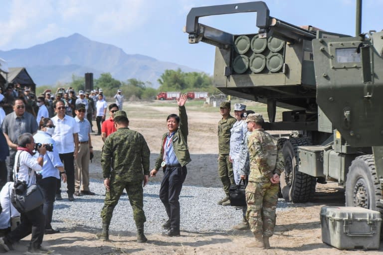 Philippine President Ferdinand Marcos inspecting a high mobility artillery rocket system on April 26, 2023 (Ted ALJIBE)