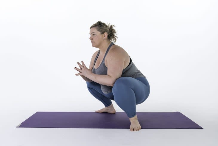 yoga for runners pose: Malasana (squat)