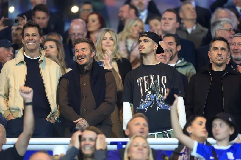 (Left to right) Tom Brady, and David and Romeo Beckham, and Gary Neville watch Birmingham City's League One clash with Wrexham