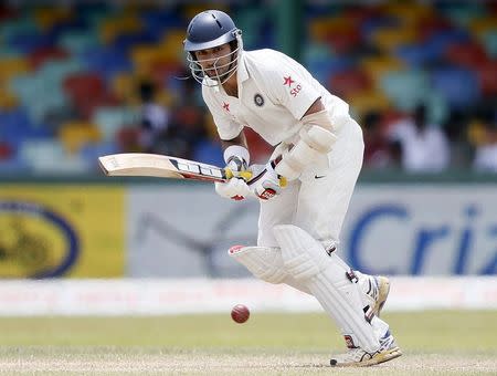 India's Naman Ojha plays a shot during the fourth day of their third and final test cricket match against Sri Lanka in Colombo August 31, 2015. REUTERS/Dinuka Liyanawatte