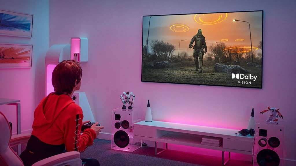  A gamer sitting in front of an LG OLED TV. 