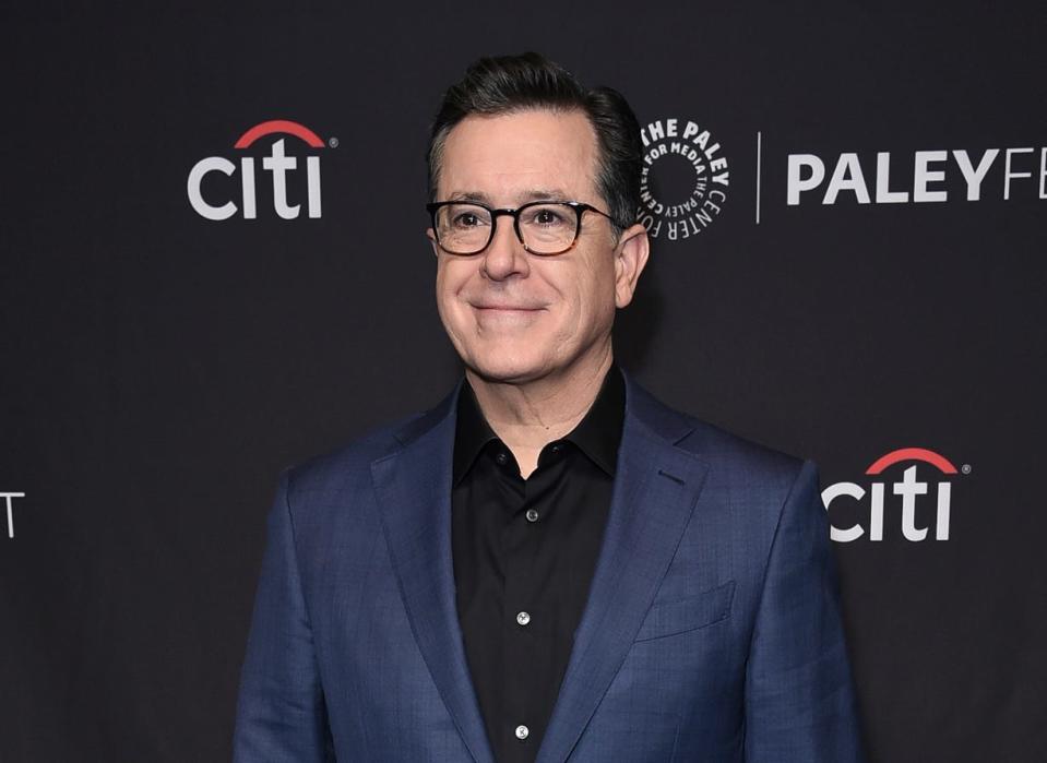 FILE - This March 16, 2019 file photo shows Stephen Colbert at the 36th Annual PaleyFest "An Evening with Stephen Colbert" event in Los Angeles. CBS announced Thursday that Colbert has signed a new contract that will keep him as the "Late Show" host through at least August 2023. His current pact was set to expire next August. (Photo by Richard Shotwell/Invision/AP, File) ORG XMIT: NYET406