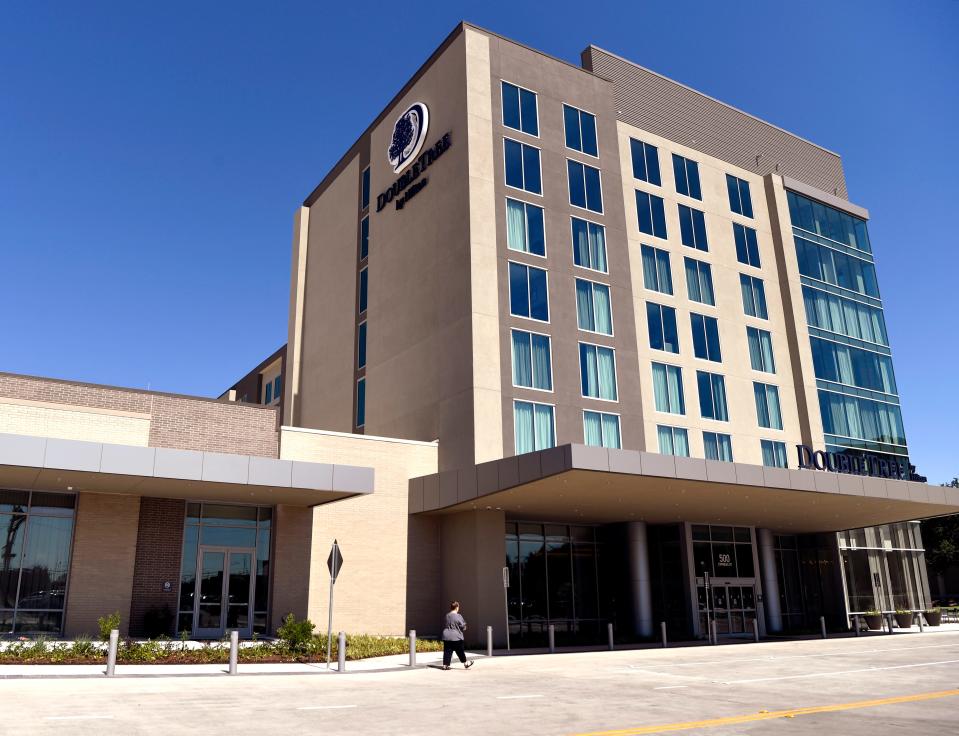 A visitor walks to the DoubleTree by Hilton on Thursday June 29, 2023. The hotel opened for guests Wednesday, 19 months after its groundbreaking in October 2021.