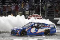 Kyle Larson celebrates on the front stretch after winning the NASCAR Cup Series All-Star auto race at Texas Motor Speedway in Fort Worth, Texas, Sunday, June 13, 2021. (AP Photo/Larry Papke)