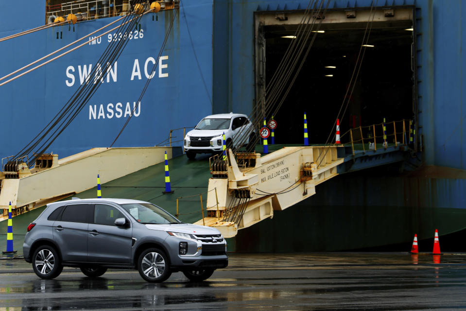 Mitsubishi cars are driven off the vehicle carrier Swan Ace at Tradepoint Atlantic, Friday, April 12, 2024, in Sparrows Point, Md. (AP Photo/Julia Nikhinson)