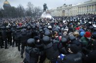 FILE - In this Jan. 23, 2021, file photo, people clash with police during a protest against the jailing of opposition leader Alexei Navalny in St.Petersburg, Russia. Allies of Navalny are calling for new protests next weekend to demand his release, following a wave of demonstrations across the country that brought out tens of thousands in a defiant challenge to President Vladimir Putin. (AP Photo/Dmitri Lovetsky, File)