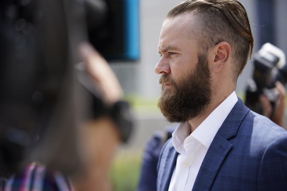 Cade Cothren leaves the federal courthouse Tuesday, Aug. 23, 2022