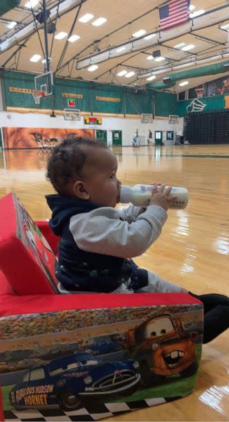 PHOTO: Aiden Webster, the son of Saint Leo University assistant basketball coach Ashley Webster, is pictured alongside the university's men's basketball team. (Pam Randall)