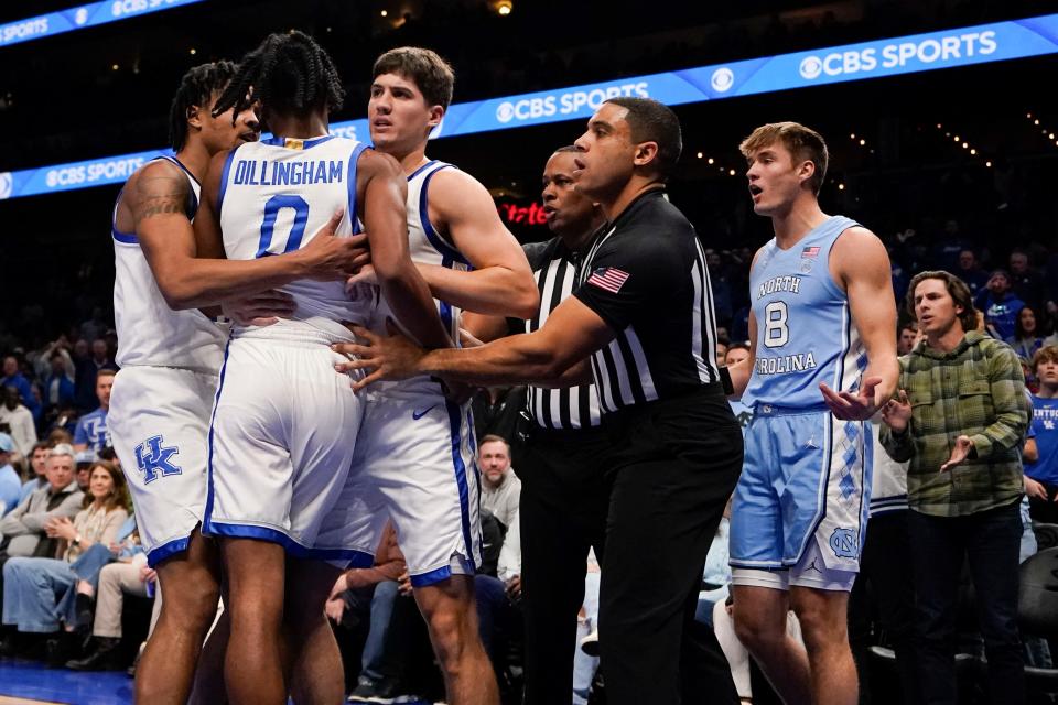 Kentucky guard Rob Dillingham (0) moves toward North Carolina guard Paxson Wojcik (8) after a foul during the first half. Dillingham scored a team-high 17 points in the Wildcats' 87-83 victory Saturday night in Atlanta.