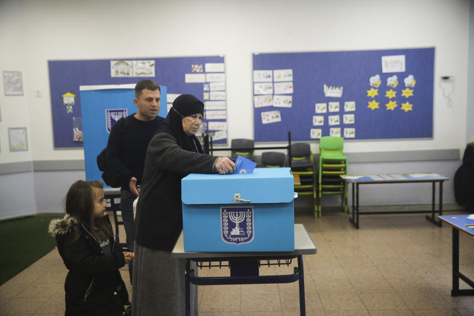 People vote during elections in Tamra, an Arab town in Israel, Monday, March 2, 2020. (AP Photo/Mahmoud Illean)