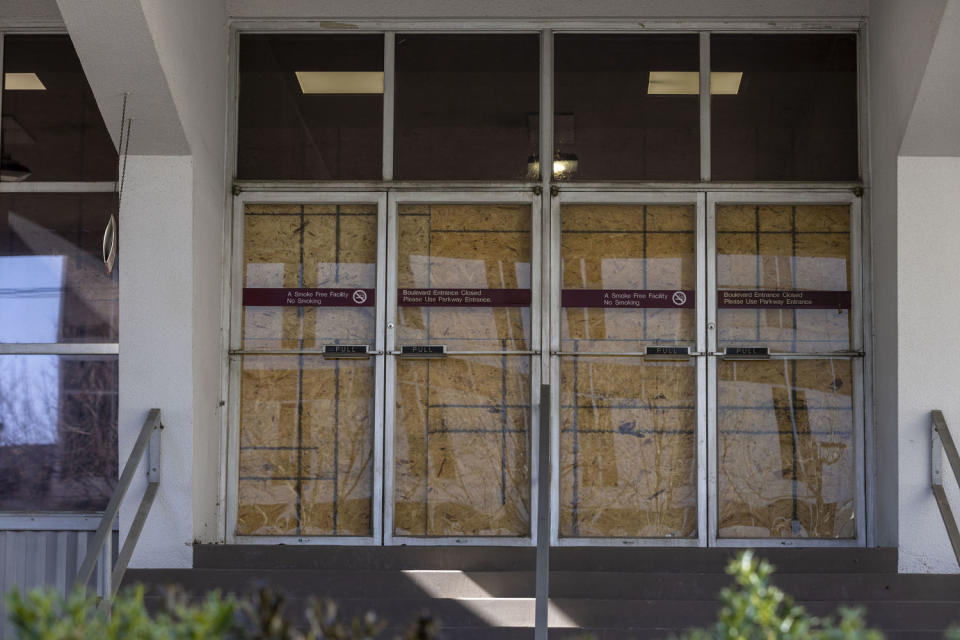 Doors are boarded up to an entrance of the permanently closed Wellstar Health System Atlanta Medical Center (Alyssa Pointer for NBC News)