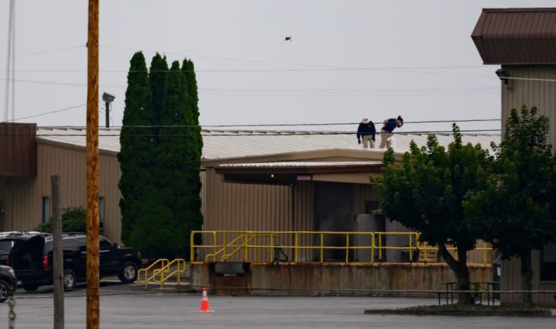FBI investigators scan the roof of AGR International Inc, the building adjacent to the Butler Fairgrounds, from which alleged shooter Matthew Thomas Crooks fired at former President Donald J. Trump, in the aftermath of the attempted assassination at a campaign rally on July 14, 2024 in Butler, Pennsylvania. (Photo by Jeff Swensen/Getty Images)