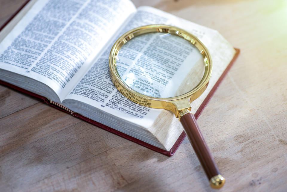 dictionary with a magnifying glass