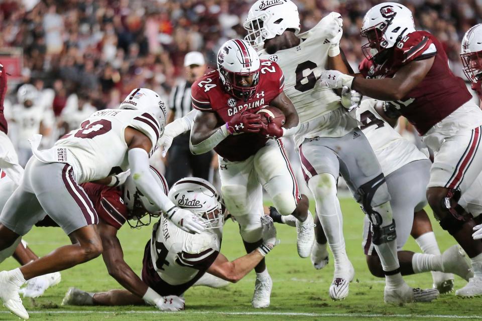 South Carolina running back Mario Anderson (24) runs over Mississippi State linebacker Jett Johnson (44) for extra yards during the first half of an NCAA college football game on Saturday, Sept. 23, 2023, in Columbia, S.C. (AP Photo/Artie Walker Jr.)