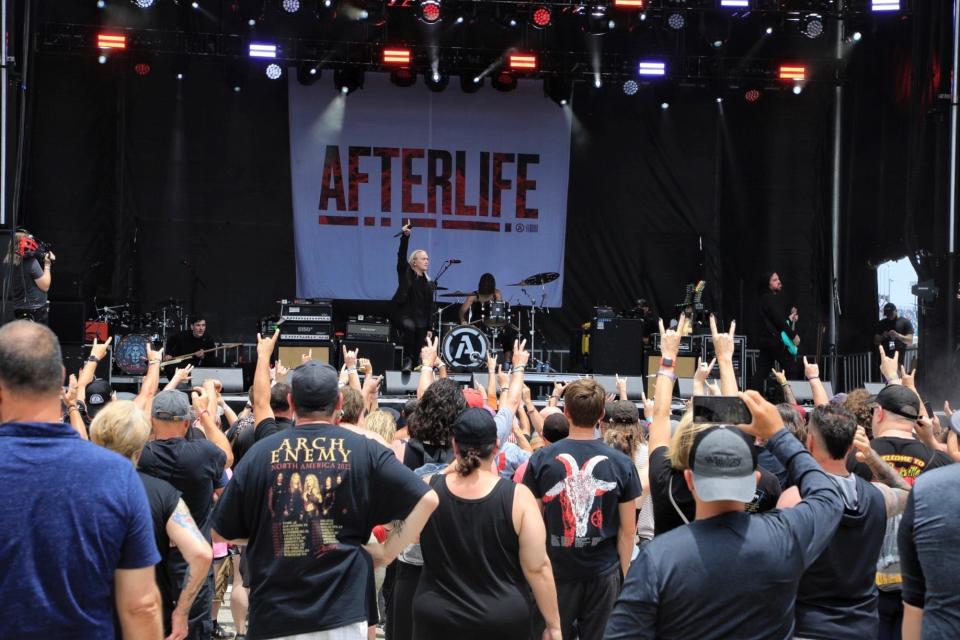 Florida-based Afterlife performs on Saturday afternoon at the Welcome to Rockville music festival at Daytona International Speedway.  Later in the day, the event again was besieged by a series of severe thunderstorms that forced the show to shut down early before the scheduled headlining set by Guns N' Roses.