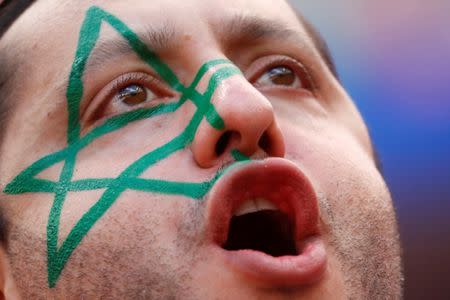 A Morocco fan inside the stadium before the match. REUTERS/Kai Pfaffenbach