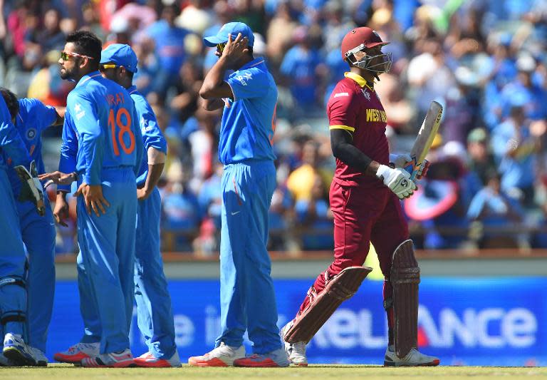 West Indies batsman Marlon Samuels walks from the ground after being run out in the World Cup Pool B match against India in Perth on March 6, 2015