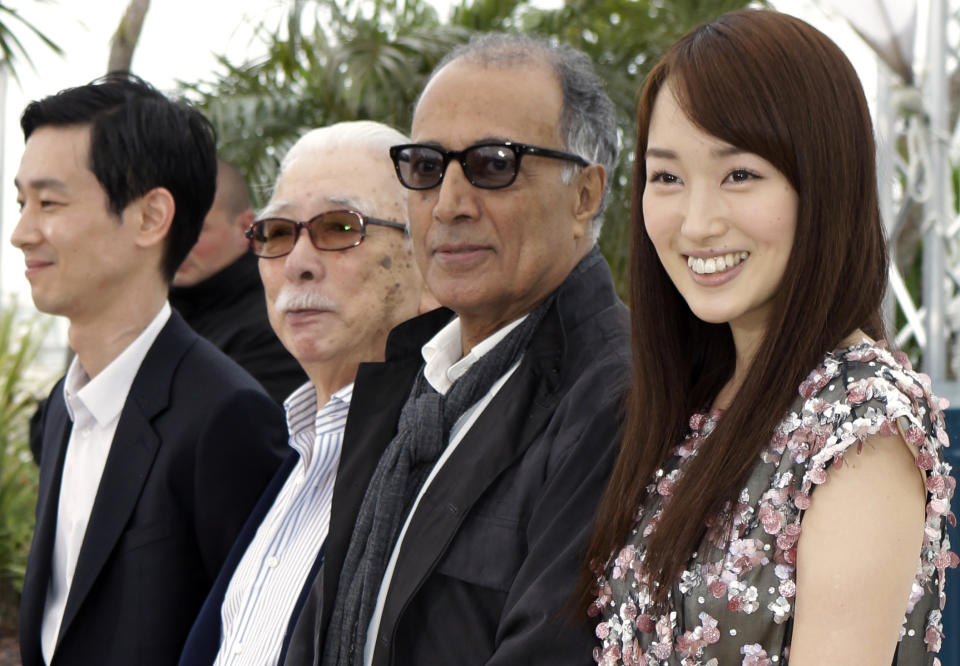 From left actors, Ryo Kase, Tadashi Okuno, director Abbas Kiarostami and actress Rin Takanashi pose during a photo call for Like Somone in Love at the 65th international film festival, in Cannes, southern France, Monday, May 21, 2012. (AP Photo/Lionel Cironneau)