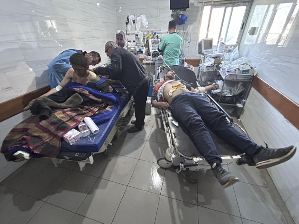 Palestinians wounded in an Israeli strike while waiting for humanitarian aid on the beach in Gaza City are treated in Shifa Hospital on Thursday, Feb. 29, 2024. (AP Photo/Mahmoud Essa)