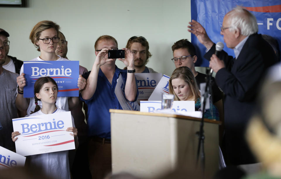 Supporters listen to Democratic presidential candidate Sen. Bernie Sanders speak during a rally with local residents on Saturday, May 30, 2015, in Ames, Iowa. 