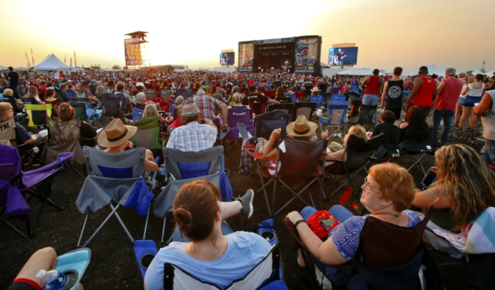 Concert-goers enjoy themselves at the 2019 Country Stampede. Visitors have an opportunity to see events free this year by volunteering for a few hours.