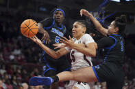 South Carolina forward Victaria Saxton (5) battles for the ball with Memphis forward Hannah Riddick (1) and Emani Jefferson (5) during the first half of an NCAA college basketball game Saturday, Dec. 3, 2022, in Columbia, S.C. (AP Photo/Sean Rayford)