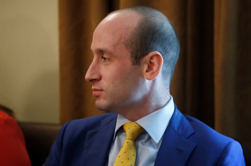 FILE PHOTO: White House adviser Stephen Miller listens as U.S. President Trump holds cabinet meeting at the White House in Washington